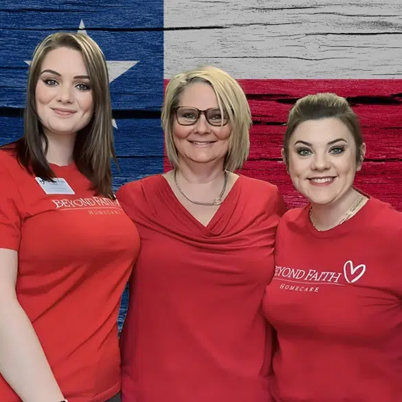 Beyond Faith Home Health team stands for a picture in front of the Texas Flag