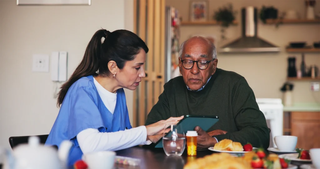 Skilled nurse reviewing medication with senior during home health visit in New Braunfels, Texas