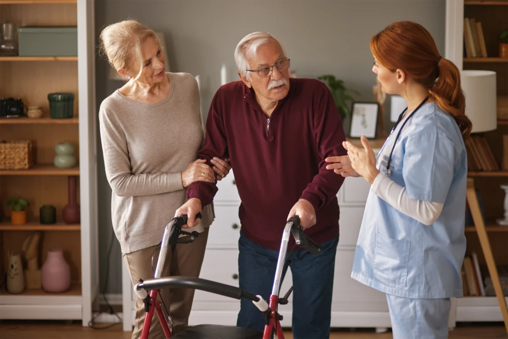 Home health nurse assisting a senior with mobility support and physical therapy in Graham, Texas