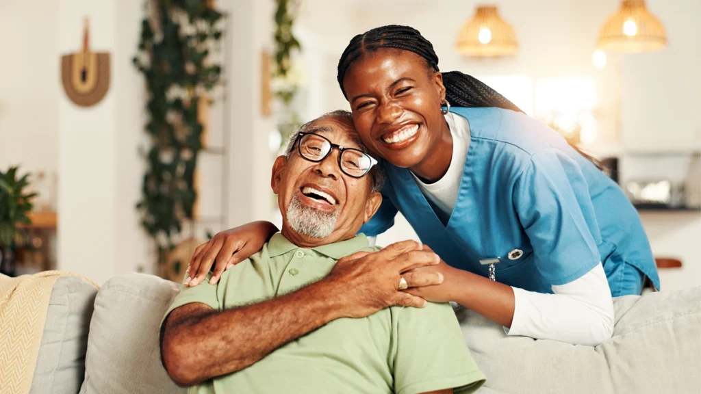 Texas home health caregiver sharing a happy moment with a senior during in-home assistance.